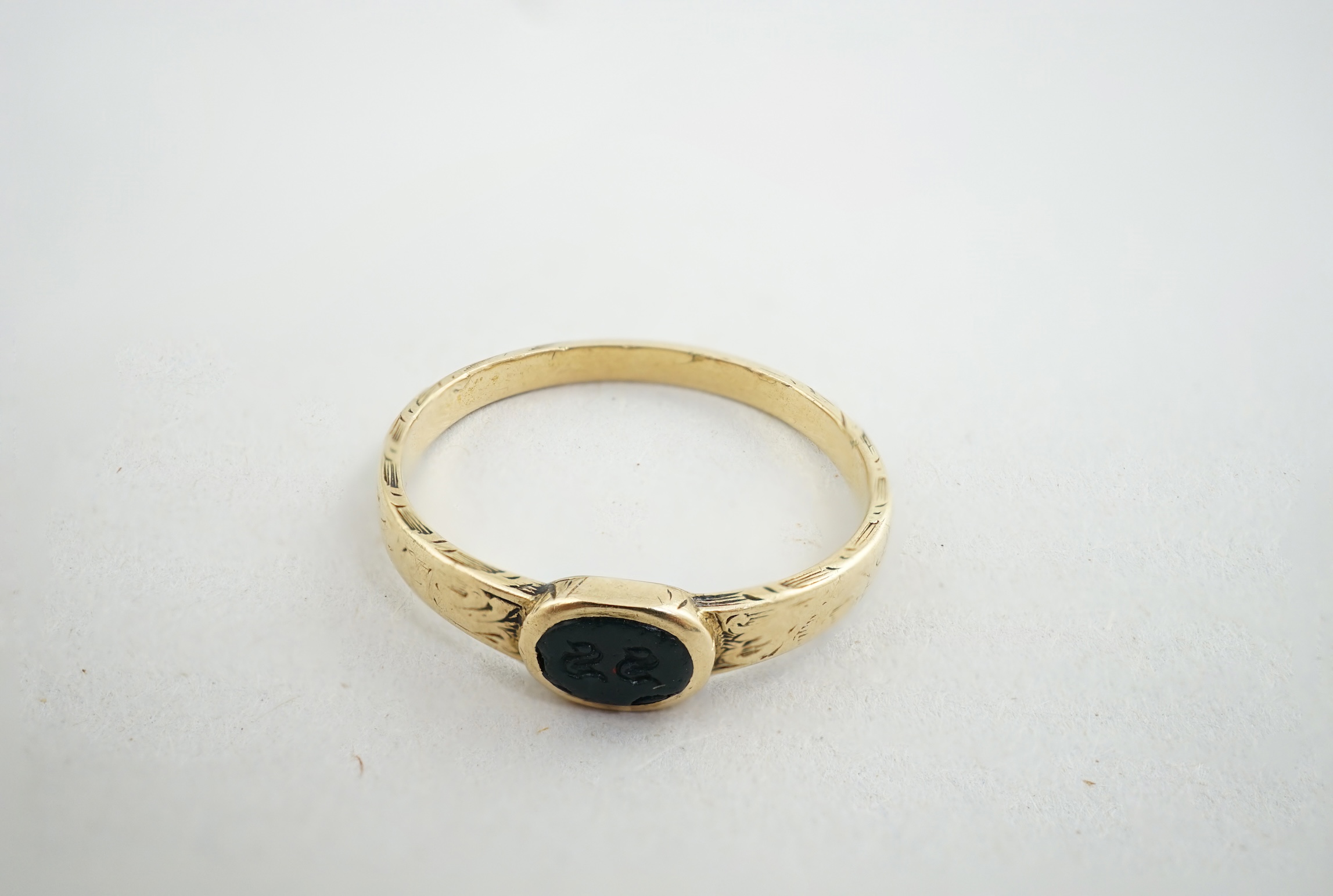 An antique engraved gold and intaglio bloodstone? set ring